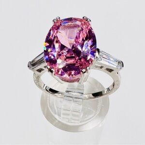 Elegant Sterling Silver Ring with Facet Cut Pink Gemstone and Baguettes